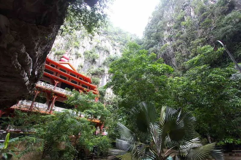 The beautiful red pagoda and tortoise pond at the back of the Sam Poh Tong Cave Temple massif